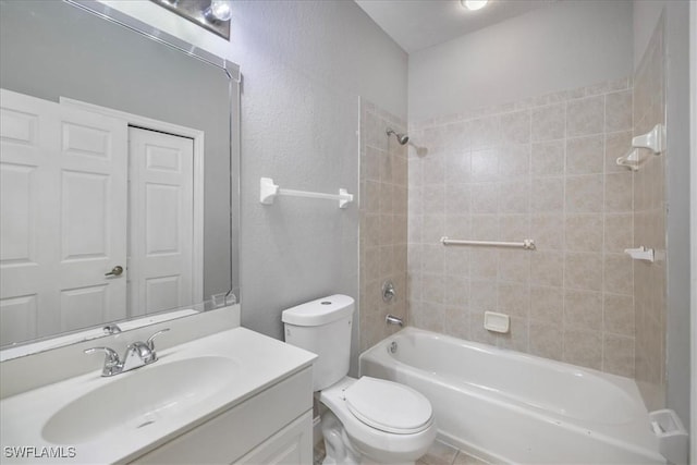 full bath with vanity, toilet, a textured wall, and bathtub / shower combination
