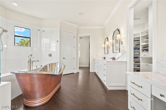 15460 Catalpa Cove Ln, Fort Myers, FL 33908 - bathroom featuring wood finished floors, crown molding, a freestanding bath, vanity, and a tile shower