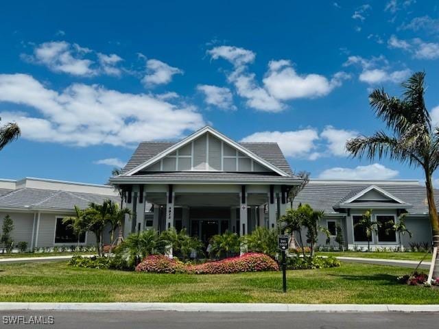 5629 Double Eagle Cir Unit 4224, Ave Maria, FL 34142 - view of front of home featuring a front yard