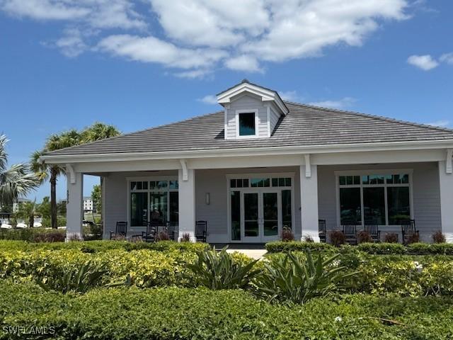 5629 Double Eagle Cir Unit 4224, Ave Maria, FL 34142 - rear view of house with covered porch