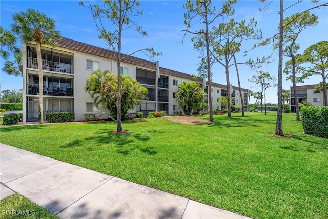 25804 Cockleshell Dr Unit 216, Bonita Springs, FL 34135 - view of property's community with a lawn