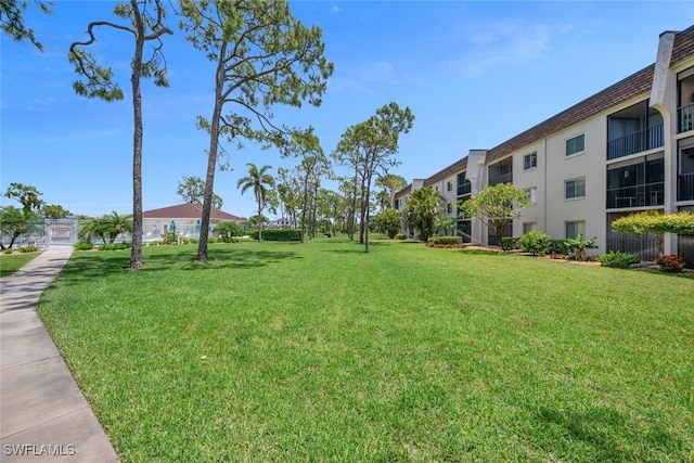 25804 Cockleshell Dr Unit 216, Bonita Springs, FL 34135 - view of property's community featuring a lawn