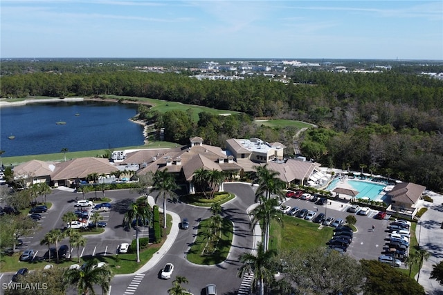 bird's eye view with a water view and a forest view