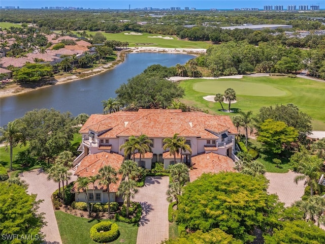 birds eye view of property with a water view, view of golf course, and a city view