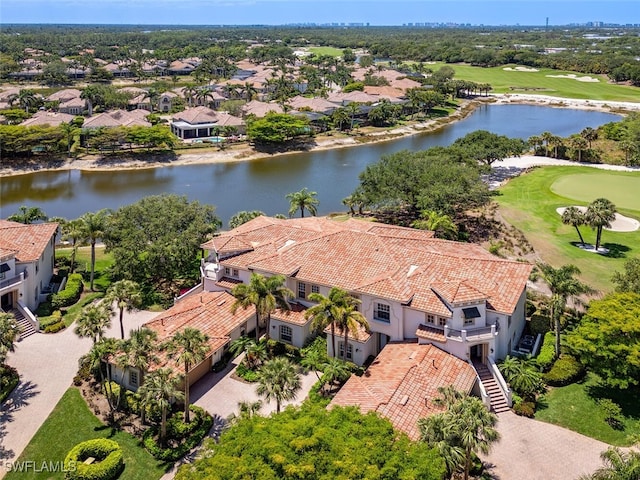 aerial view featuring a water view, view of golf course, and a residential view