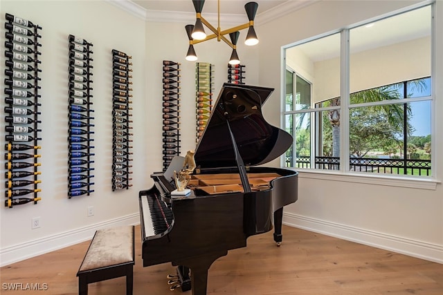 16995 Porta Vecchio Way Unit 202, Naples, FL 34110 - living area with ornamental molding, wood finished floors, and baseboards