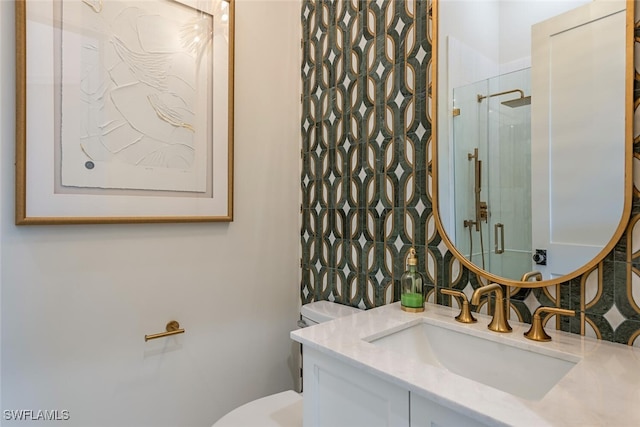 full bathroom with a walk in shower, toilet, and vanity