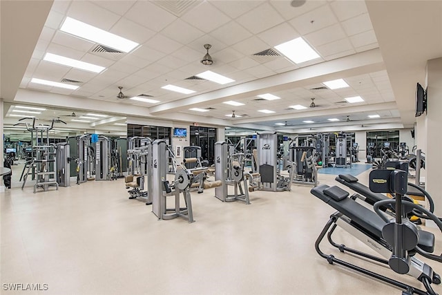exercise room featuring visible vents and a paneled ceiling
