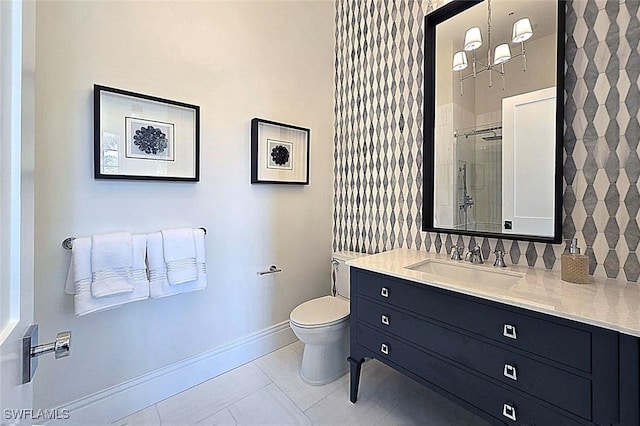 16995 Porta Vecchio Way Unit 202, Naples, FL 34110 - bathroom featuring toilet, baseboards, vanity, tile patterned flooring, and tiled shower