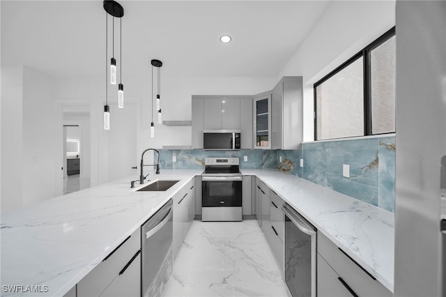 4026 SE 3rd Ave, Cape Coral, FL 33904 - kitchen featuring stainless steel appliances, gray cabinetry, a sink, and modern cabinets