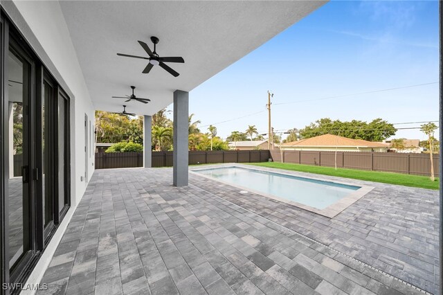 4026 SE 3rd Ave, Cape Coral, FL 33904 - view of pool featuring a fenced backyard, a fenced in pool, ceiling fan, and a patio area