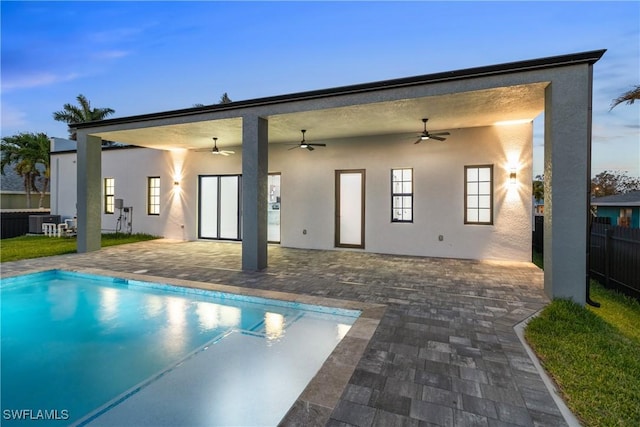 4026 SE 3rd Ave, Cape Coral, FL 33904 - rear view of property with ceiling fan, fence, central AC, and stucco siding