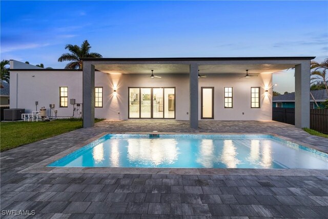 4026 SE 3rd Ave, Cape Coral, FL 33904 - view of swimming pool with fence, a ceiling fan, central AC unit, and a patio area