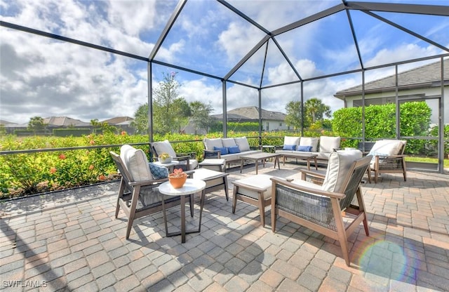 view of patio featuring outdoor lounge area and a lanai
