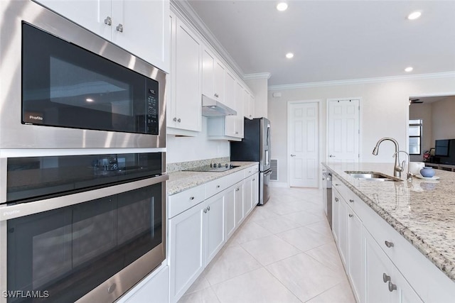 kitchen with crown molding, appliances with stainless steel finishes, a sink, under cabinet range hood, and white cabinetry