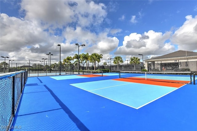 view of sport court with fence and community basketball court
