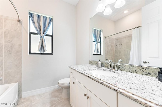 full bath featuring plenty of natural light, tile patterned flooring, toilet, and vanity