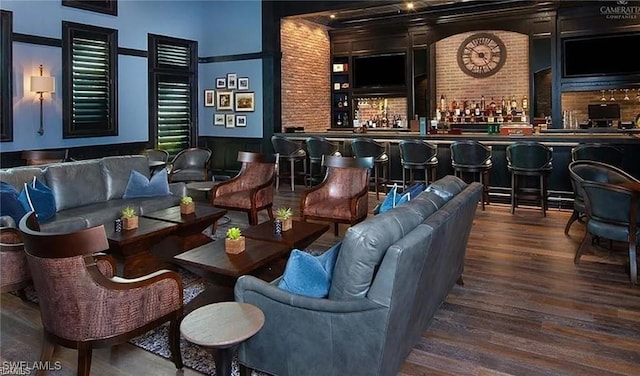 interior space featuring a wainscoted wall and wood finished floors