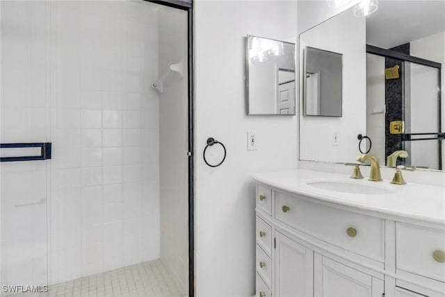 full bath with a shower stall and vanity