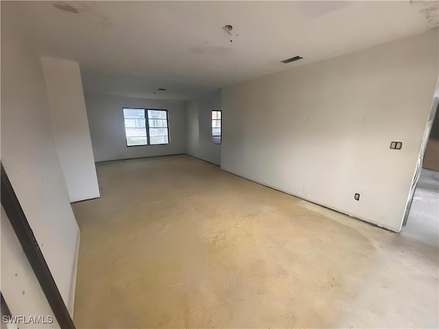 empty room featuring concrete flooring