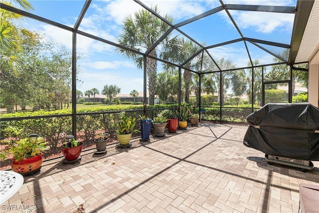 view of patio / terrace with a lanai and grilling area