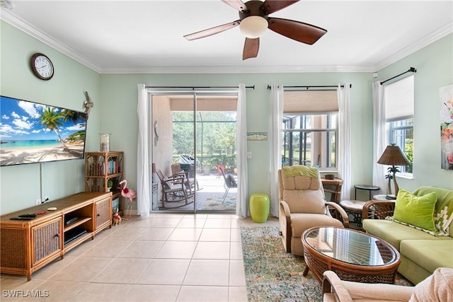 living area featuring a ceiling fan, light tile patterned floors, and crown molding
