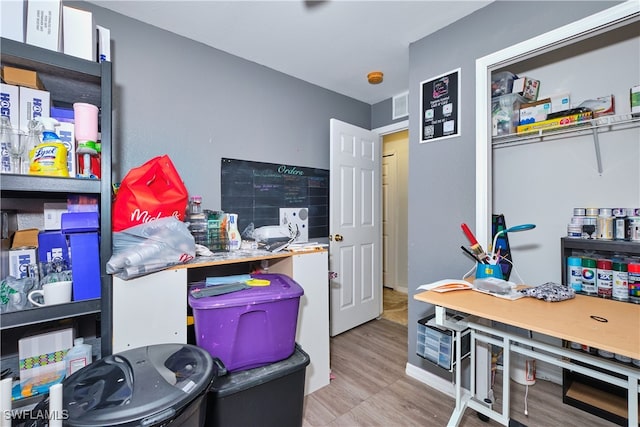 office area with wood finished floors and baseboards