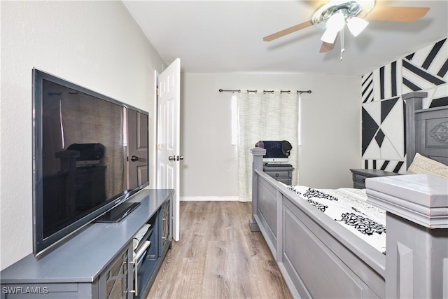 bedroom featuring light wood-type flooring and a ceiling fan