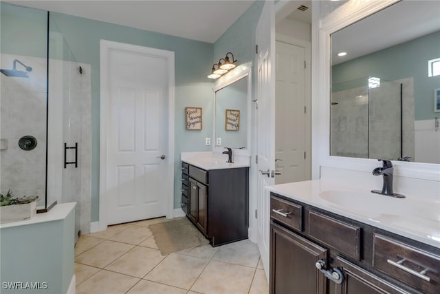 20263 Cypress Shadows Blvd, Estero, FL 33928 - bathroom featuring tile patterned floors, a stall shower, two vanities, and a sink