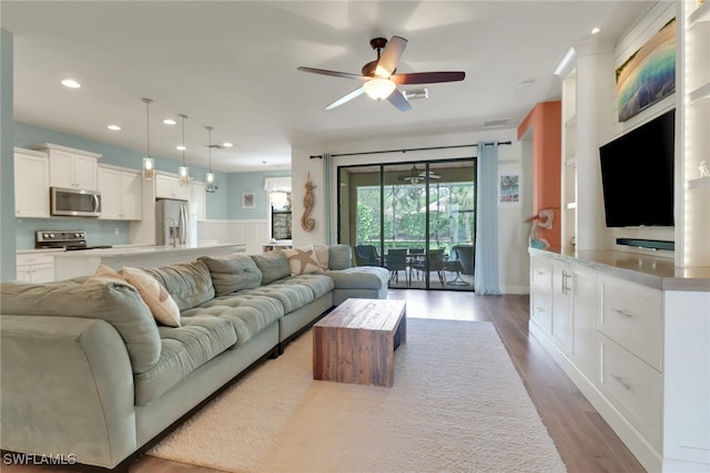 20263 Cypress Shadows Blvd, Estero, FL 33928 - living room featuring recessed lighting, wainscoting, ceiling fan, visible vents, and wood finished floors