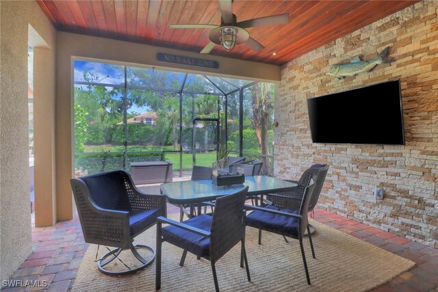 20263 Cypress Shadows Blvd, Estero, FL 33928 - sunroom with outdoor dining space, a wealth of natural light, and a ceiling fan