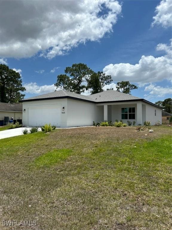 5525 Berryman St, Lehigh Acres, FL 33971 - view of side of home with a garage, a yard, stucco siding, and concrete driveway