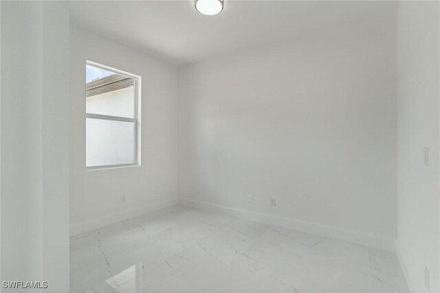 6014 Joplin Ave, Fort Myers, FL 33905 - empty room with baseboards and marble finish floor