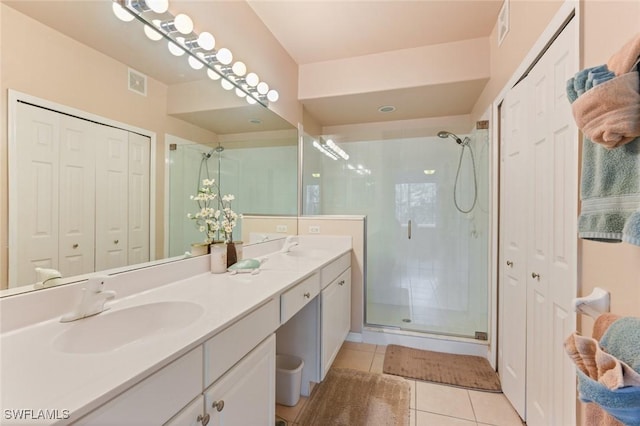 11019 Mill Creek Way Unit 903, Fort Myers, FL 33913 - full bathroom featuring a sink, tile patterned floors, a shower stall, and a closet