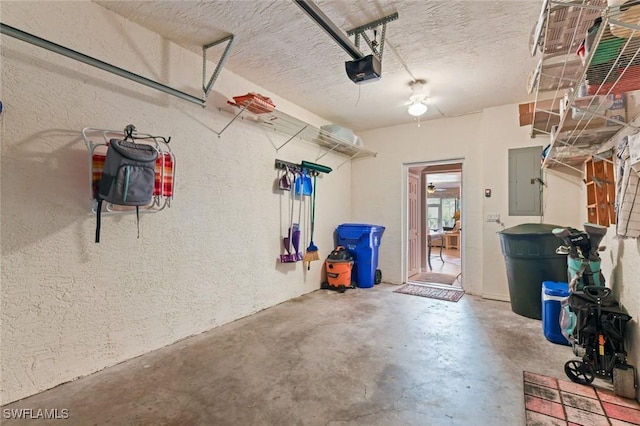 11019 Mill Creek Way Unit 903, Fort Myers, FL 33913 - garage featuring a textured wall, a garage door opener, and electric panel