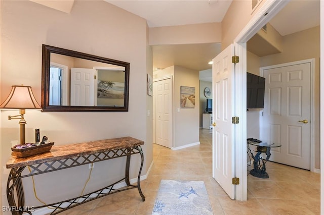 11019 Mill Creek Way Unit 903, Fort Myers, FL 33913 - hall with baseboards and light tile patterned flooring