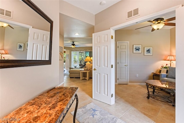 11019 Mill Creek Way Unit 903, Fort Myers, FL 33913 - corridor with baseboards, visible vents, and light tile patterned floors