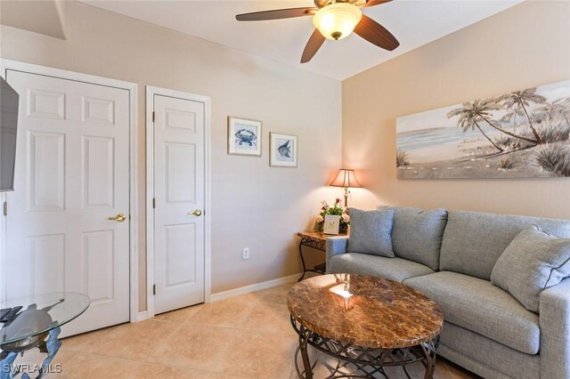 11019 Mill Creek Way Unit 903, Fort Myers, FL 33913 - living room featuring light tile patterned flooring, a ceiling fan, and baseboards