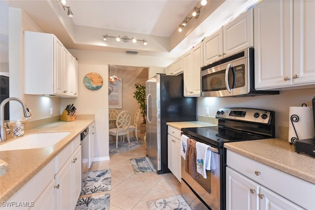 11019 Mill Creek Way Unit 903, Fort Myers, FL 33913 - kitchen featuring a sink, appliances with stainless steel finishes, white cabinets, and light countertops