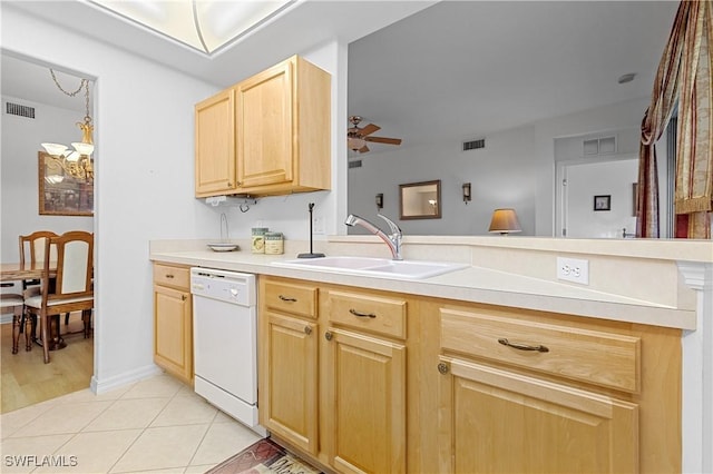 kitchen with a sink, light brown cabinets, visible vents, and dishwasher