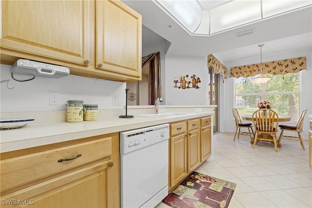 kitchen featuring white dishwasher, light brown cabinets, light tile patterned floors, and light countertops