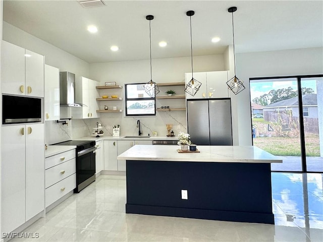 kitchen with open shelves, a sink, freestanding refrigerator, electric stove, and wall chimney exhaust hood