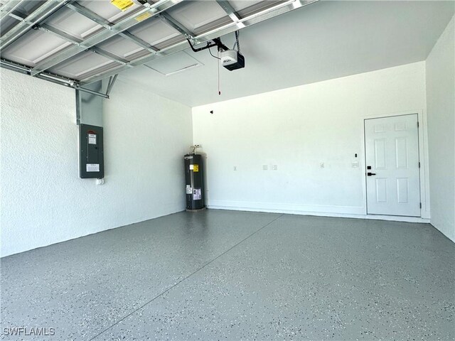 garage featuring a garage door opener, electric panel, and electric water heater