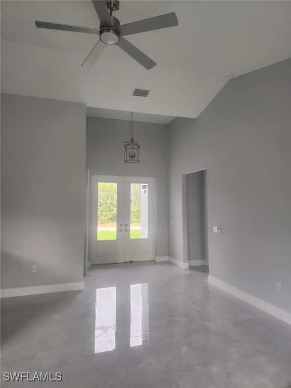 unfurnished room featuring visible vents, baseboards, ceiling fan, french doors, and concrete floors