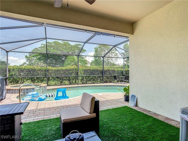 2846 Via Piazza Loop, Fort Myers, FL 33905 - outdoor pool featuring a patio, ceiling fan, a hot tub, and a lanai