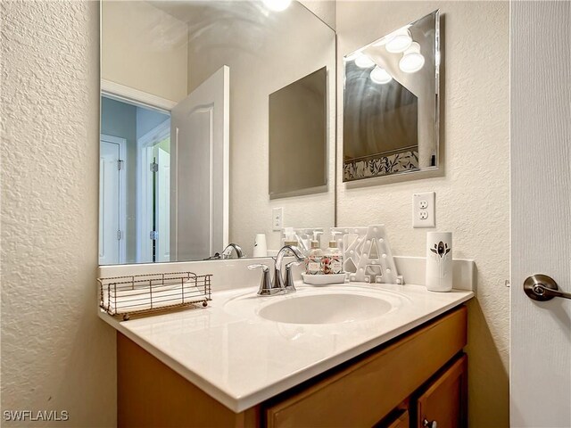 2846 Via Piazza Loop, Fort Myers, FL 33905 - bathroom with vanity and a textured wall