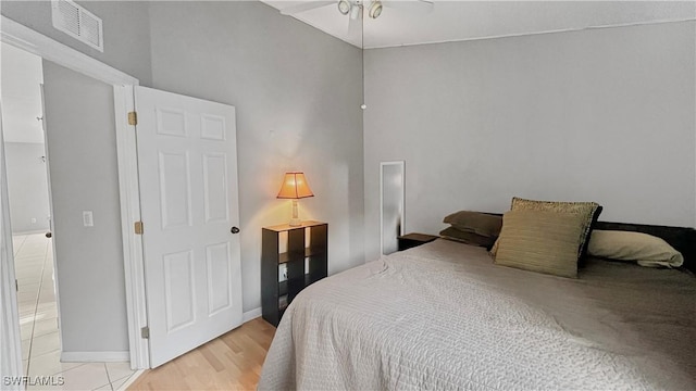17942 Oakmont Ridge Cir, Fort Myers, FL 33967 - bedroom with baseboards, light wood-style floors, and a ceiling fan