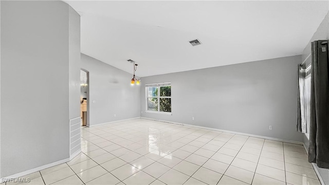 17942 Oakmont Ridge Cir, Fort Myers, FL 33967 - unfurnished room featuring lofted ceiling, light tile patterned floors, and baseboards
