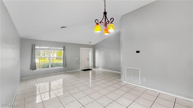 17942 Oakmont Ridge Cir, Fort Myers, FL 33967 - empty room with a chandelier, light tile patterned flooring, lofted ceiling, and baseboards