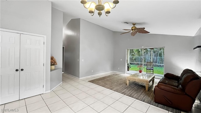 17942 Oakmont Ridge Cir, Fort Myers, FL 33967 - living room with vaulted ceiling, light tile patterned floors, a chandelier, ceiling fan, and baseboards